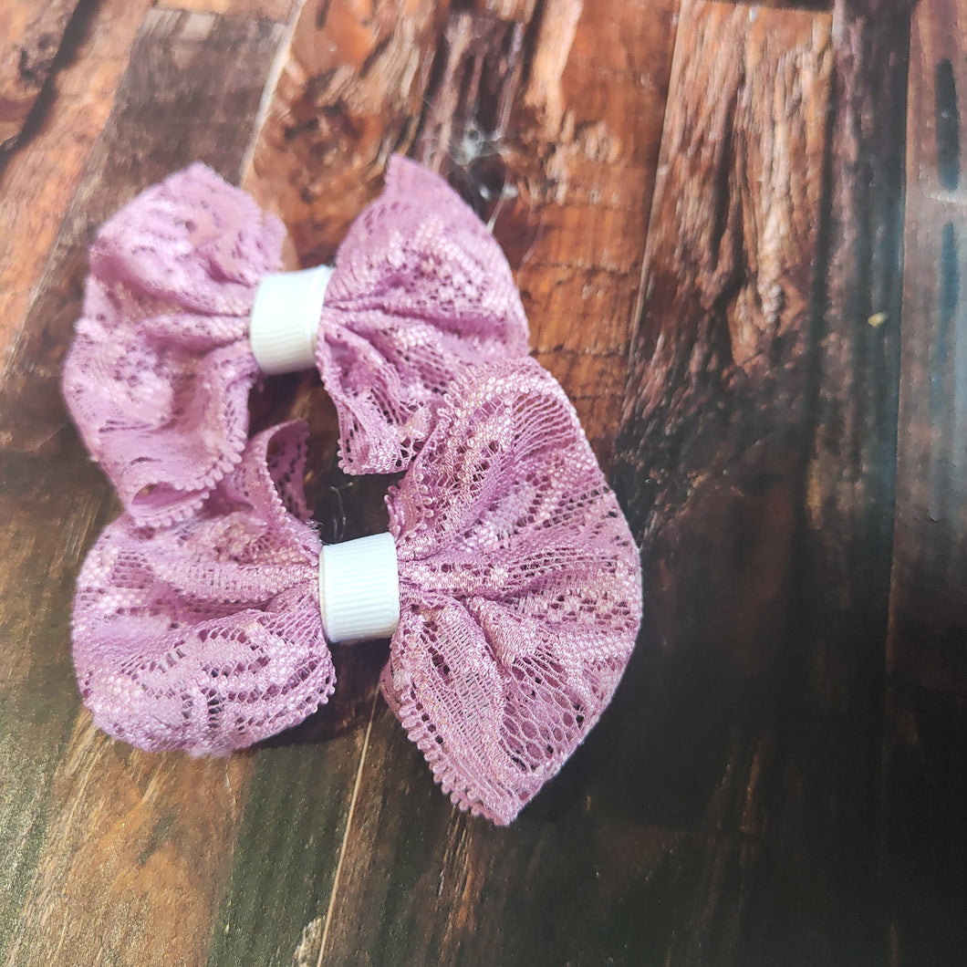 Purple pigtail lace bows