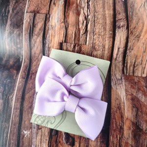 Purple pigtail bows