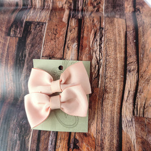 Peach pigtail bows