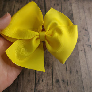 Yellow pinwheel bow headband