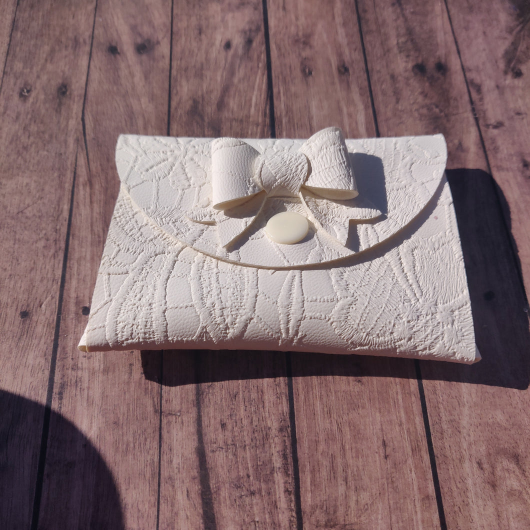 white pouch purse