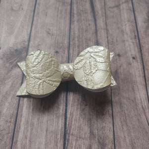 pale bronze embossed bow