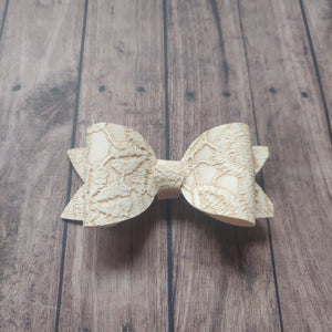 ivory embossed bow